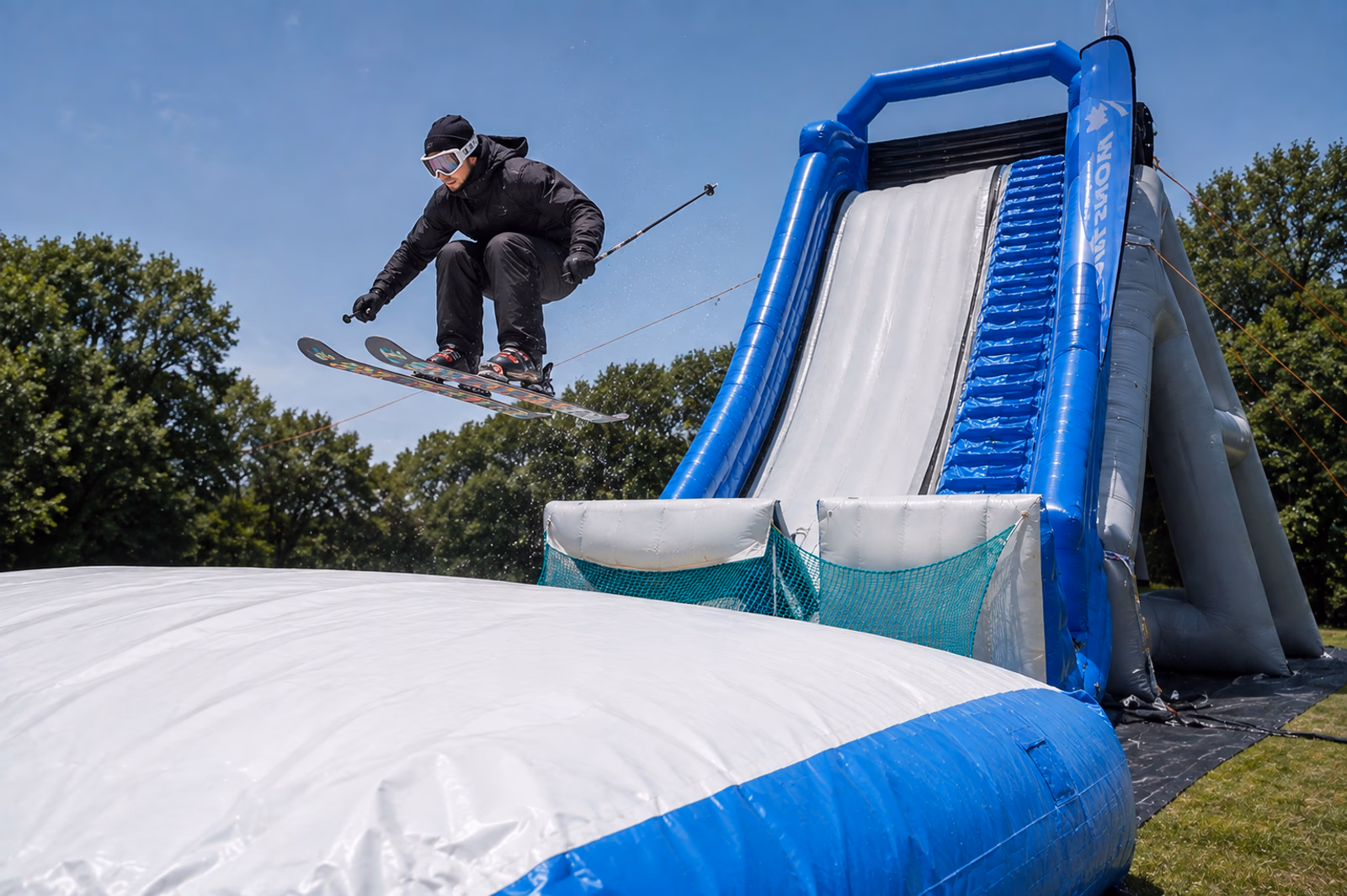 Skier jumping on a Pearljump inflatable setup
